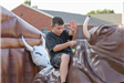 Kid Riding a Bucking Bull Machine