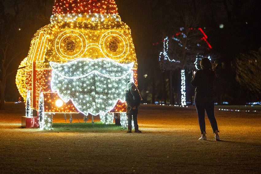 A Bus Decorated with Lights to Look like Santa Claus