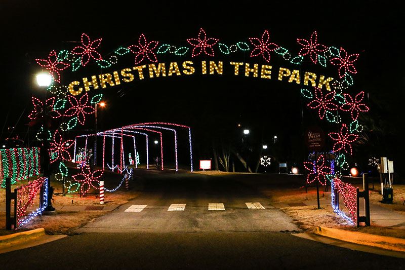 Sign of Lights over a Park Road Saying Christmas in the Park