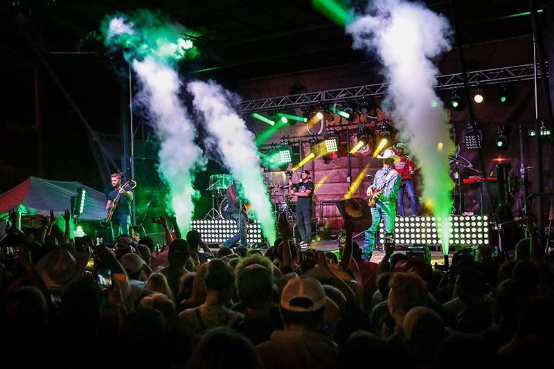 Smoke Machines and Lights Filling a Concert Stage